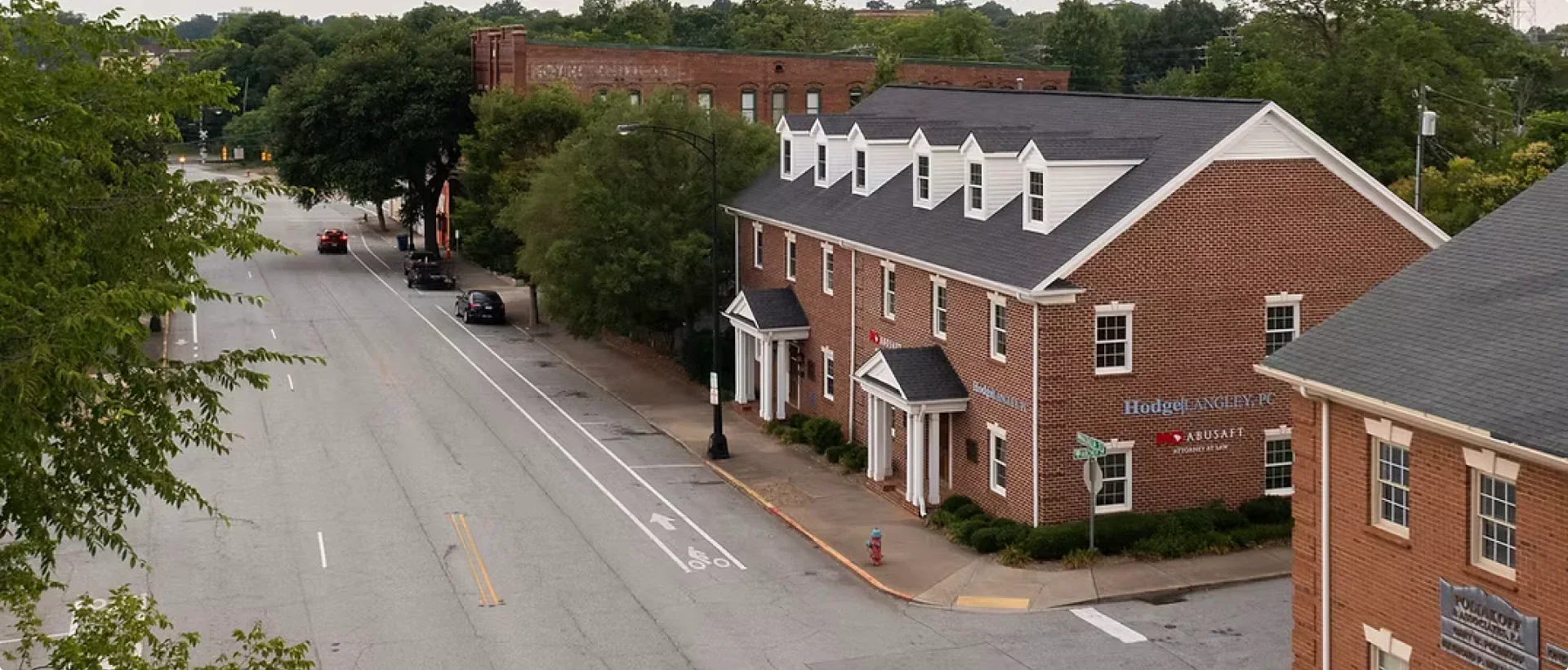 An urban street view with a red brick building