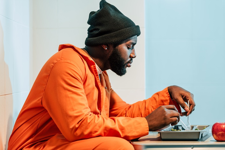Prisoner eating a meal