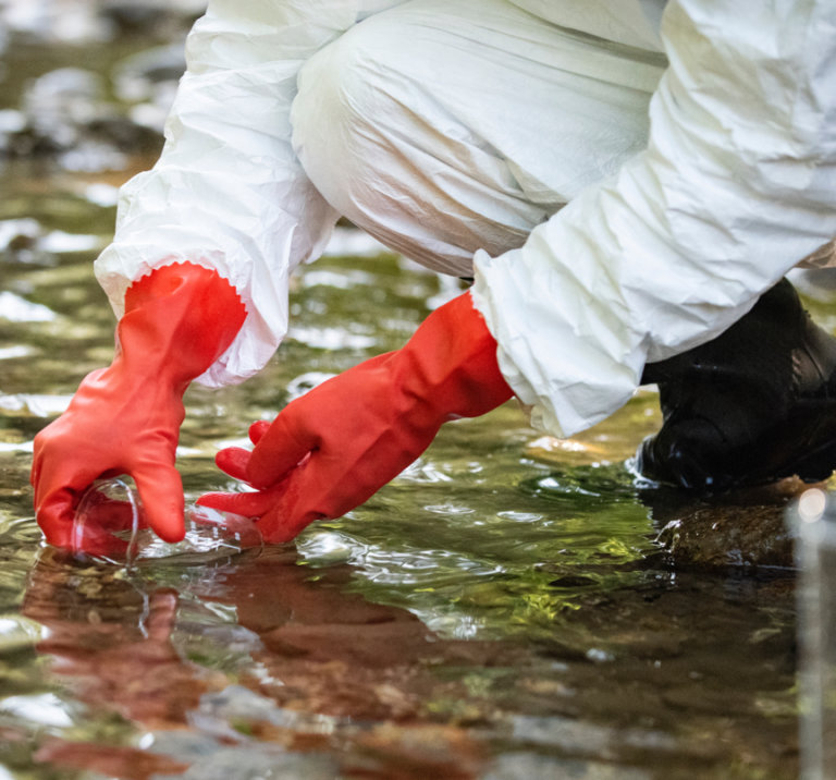 Scientist collecting water samples.