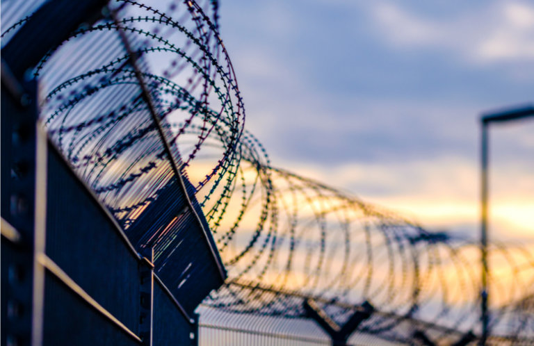 Barbed wire outside of a prison facility.